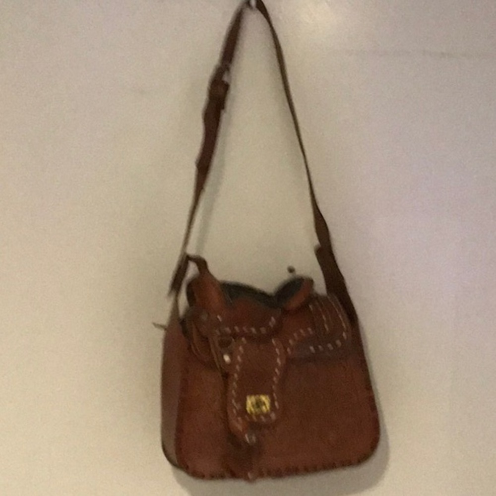 Equestrian western saddle shoulder bag.